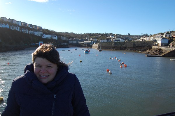 Alexa in front of Mevagissey harbour in Cornwall.